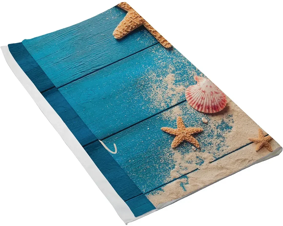 Branded Boardwalk microfiber beach towel spread poolside, promotional beach towel angled view