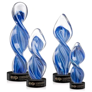 Glass Award With Blue Accents Suspended in a Twisting Form