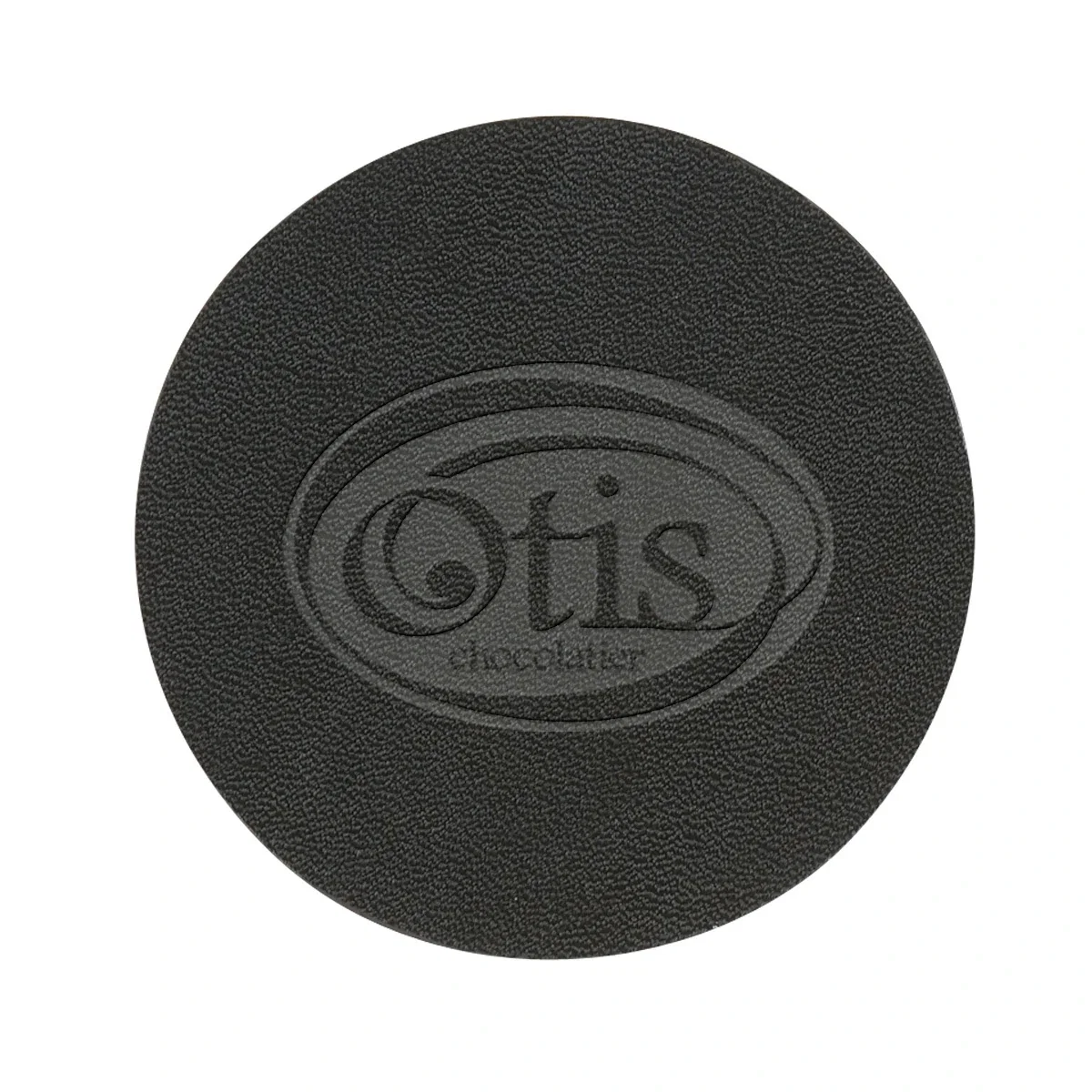 Underside of the coaster showing a uniformly flat black finish