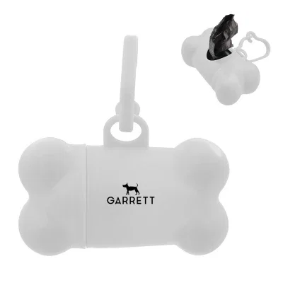 Bone shaped waste bag dispenser clipped to a dog leash