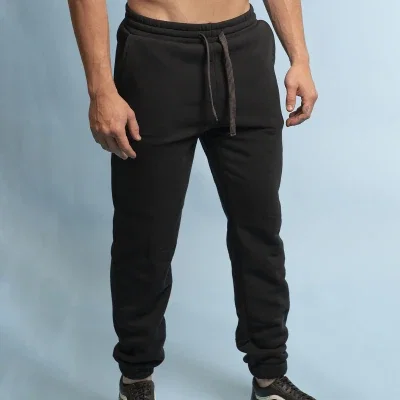 Street jogger pants shown in black with cuffed ankles