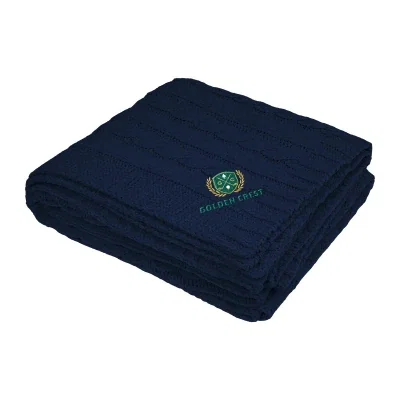 Cable knit chenille blanket folded to show its texture