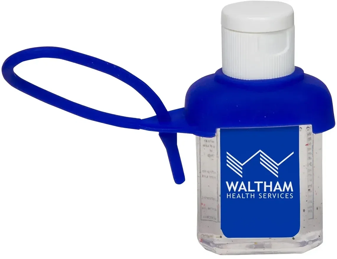 Custom Caddy Strap gel hand sanitizer strapped to a bag handle