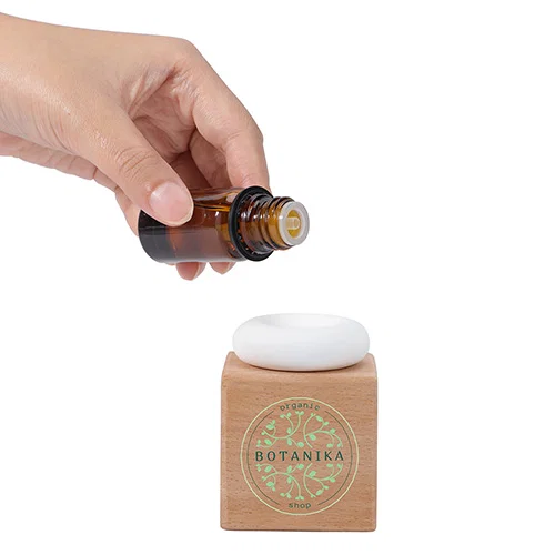 Promotional Caprice gypsum stone diffuser on a wood block, custom branded aromatherapy gift in use