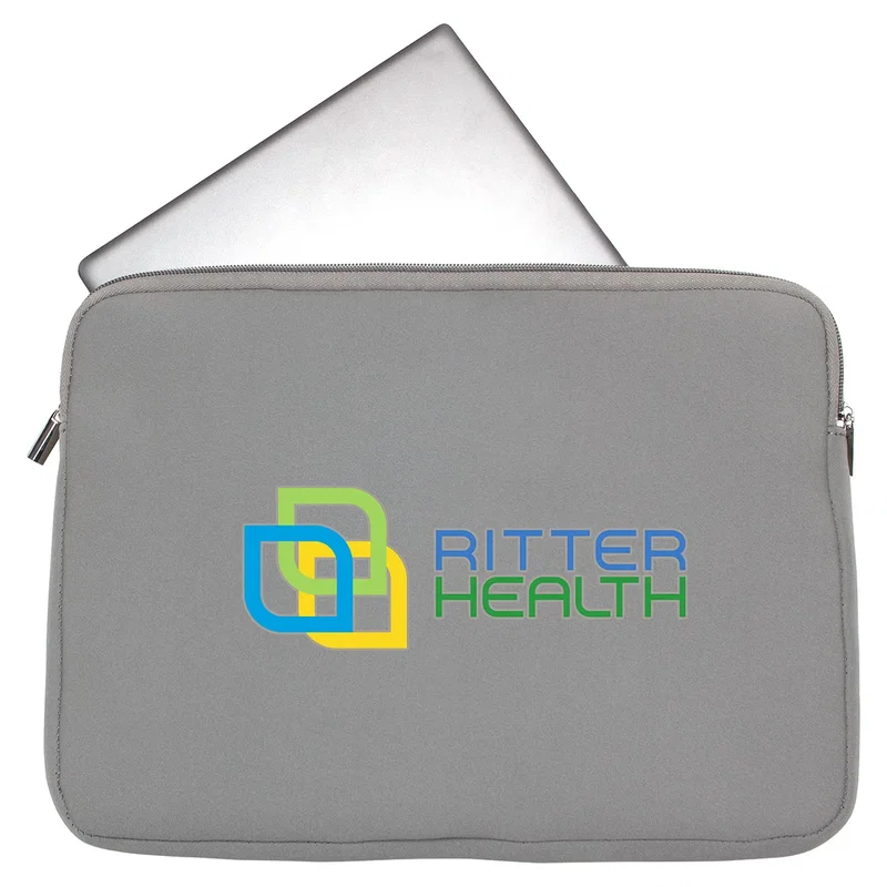 Angled view of the branded Chalet Neoprene Laptop Sleeve on a desk