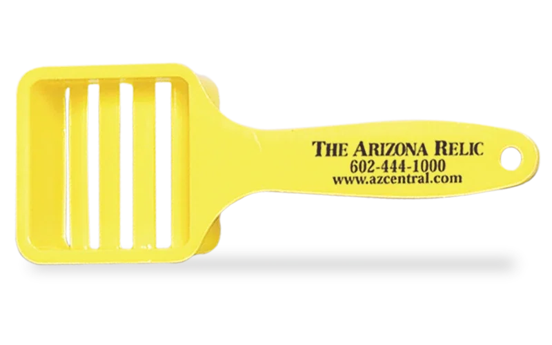 Champion Slide-On Corn Butterer. Bright yellow polypropylene corn butter spreader for picnics and cookouts