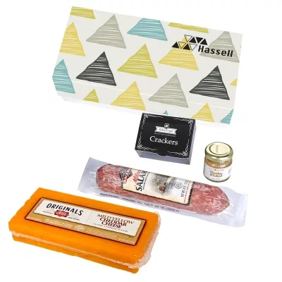 Meat and cheese portions arranged inside the opened gift set