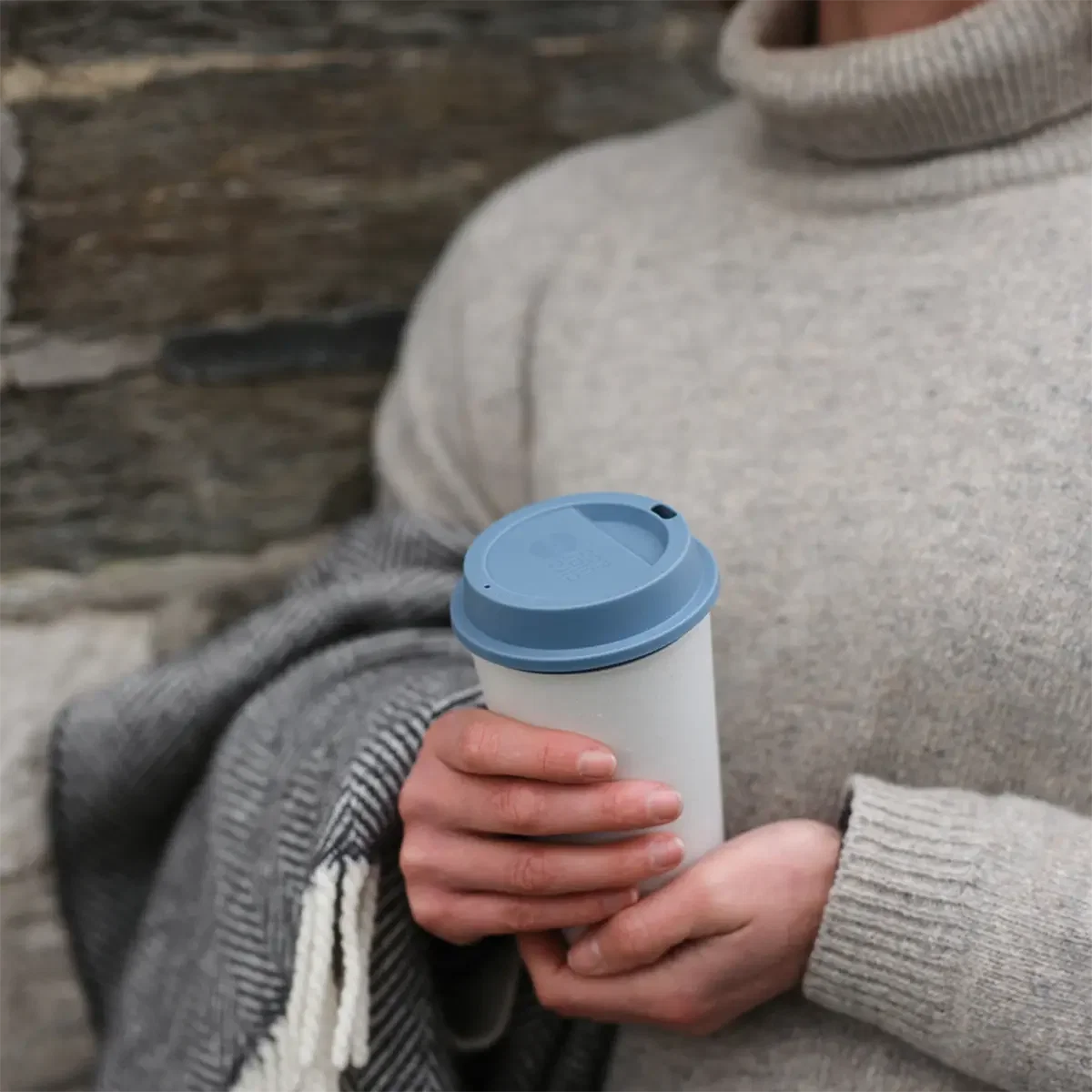 Circular 12 oz. NOW Cup held in hand