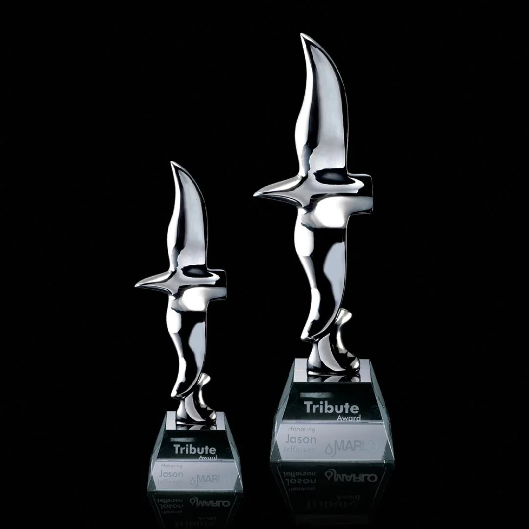 Custom Chrome Flying Eagle Award on Optical Crystal Base for employee recognition