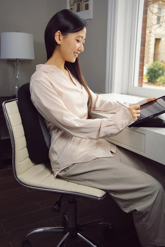 Angled view of the custom Comfort Logic Heavenly Support Back Pillow's contoured shape