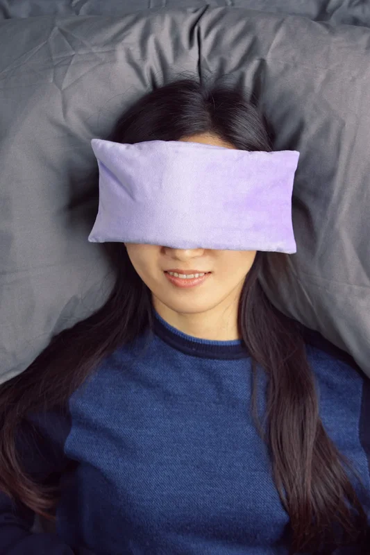 Comfort Pals Heat Therapy Eye Pillow shown in use for relaxing warmth over the eyes