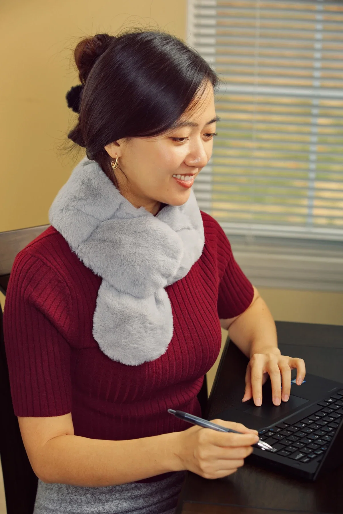 Comfort Pals Heat Therapy Neck Wrap draped around the neck, shown in use
