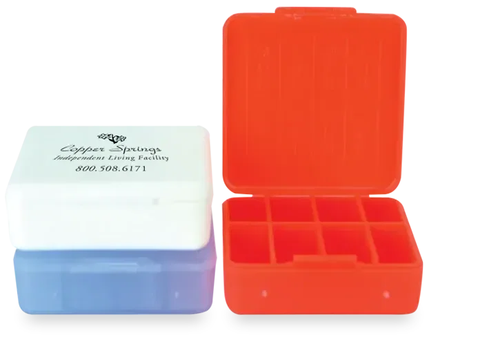 Compact Pill Box. Compact 8-compartment weekly pill box for pharmacy and health fair giveaways