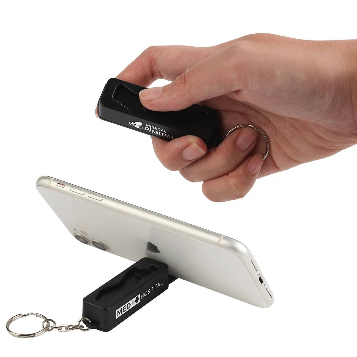 Contour Phone Stand Key Chain in use, propping up a smartphone