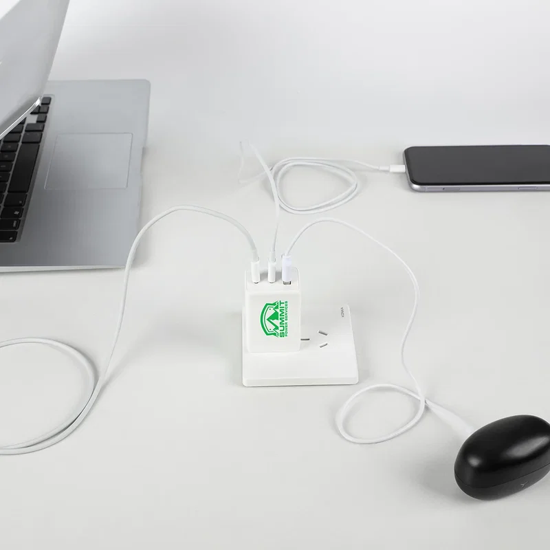Convoy 65W Wall Charger plugged into an outlet, in-use shot