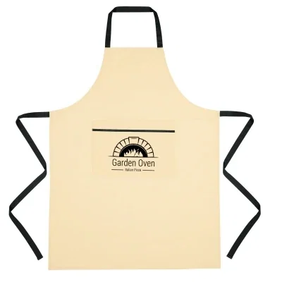 Natural cotton apron with contrasting trim along the edges