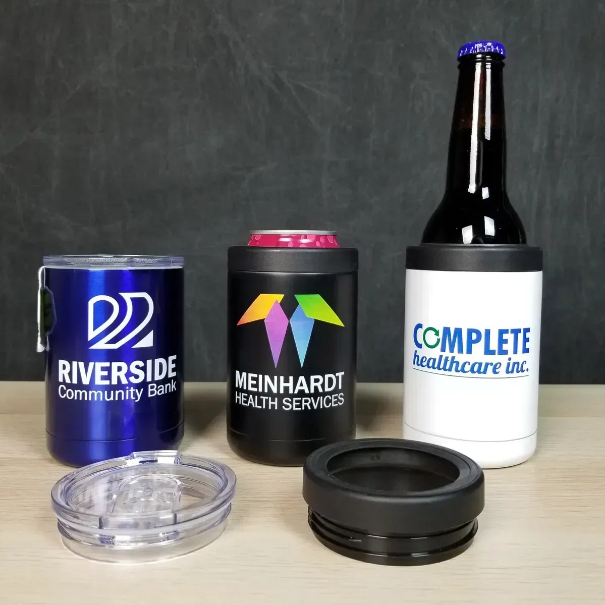 custom Coventry tumbler with lid off, branded 12 oz stainless can cooler cup