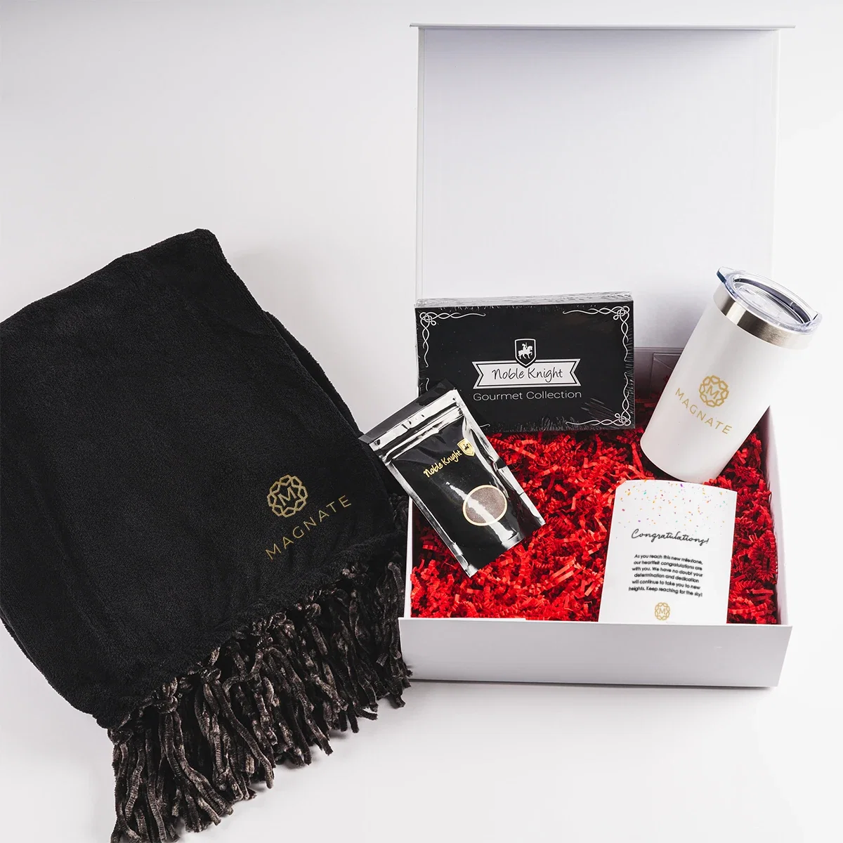 Gift box open to display the drinkware and coffee pouch