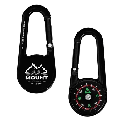 Compass in royal blue clipped to a backpack strap
