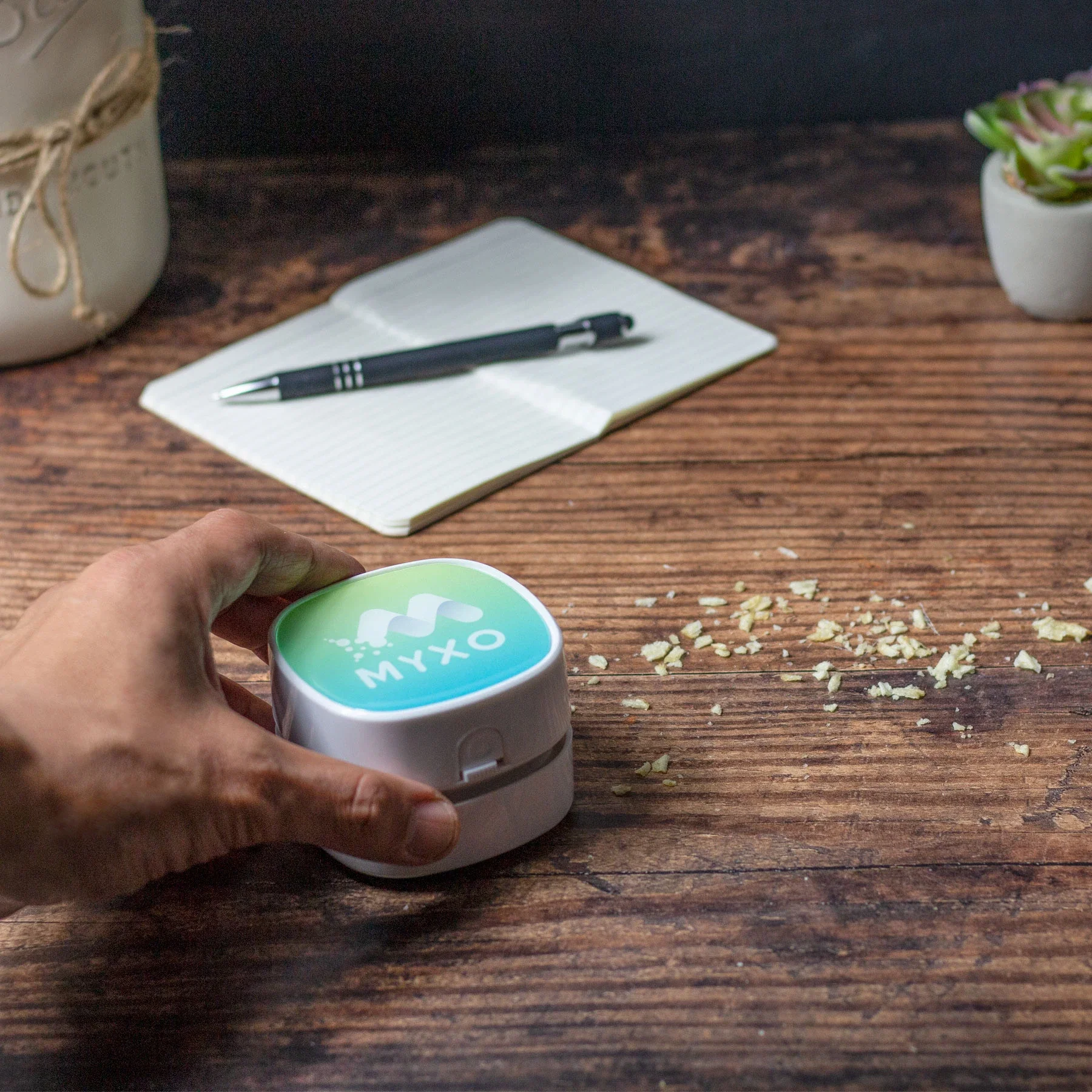 Crumbee Desktop Vacuum held in hand