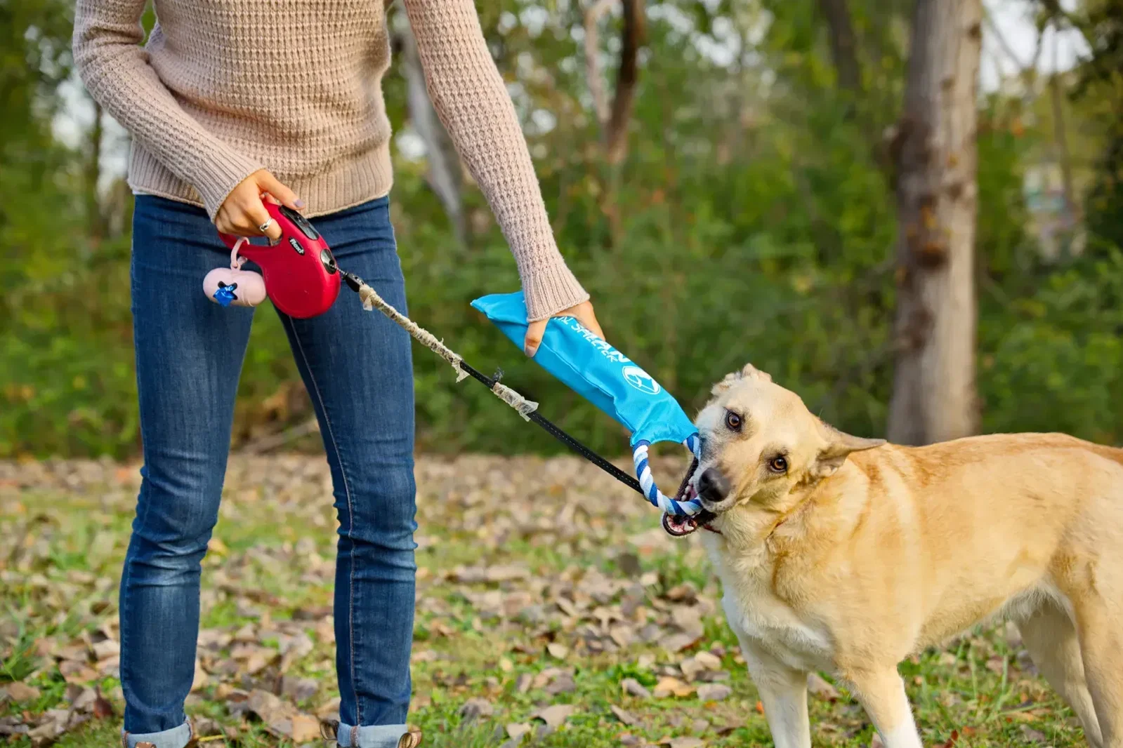 Branded promotional Crunch-It dog toy showing refillable bottle sleeve opening