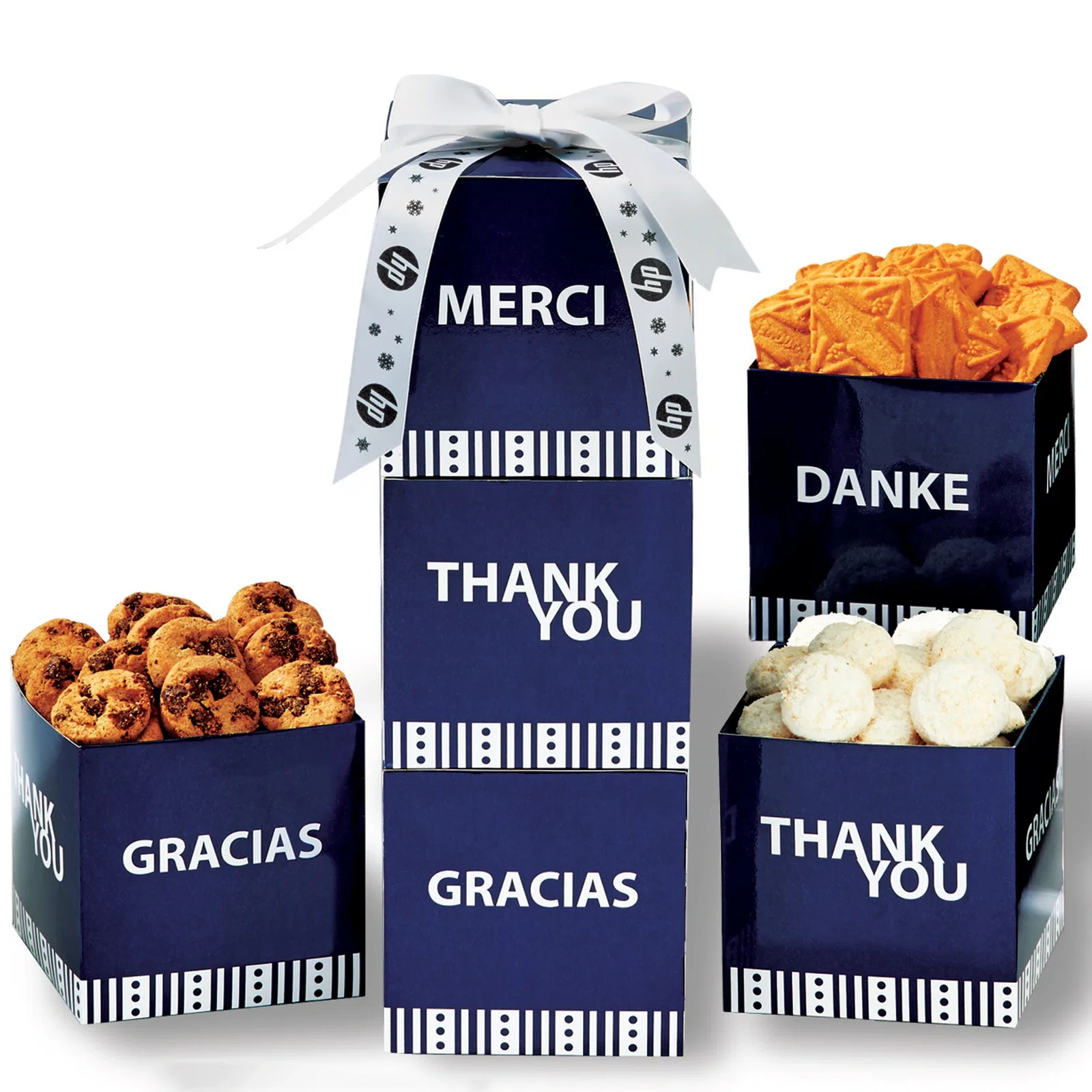Three white boxes assembled into a tower of assorted cookies