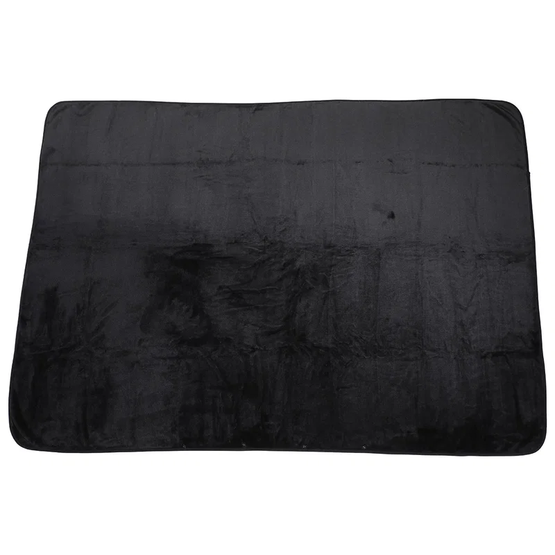 Close-up of the Cuddle Micro Plush Travel Blanket's soft plush texture and hood detail
