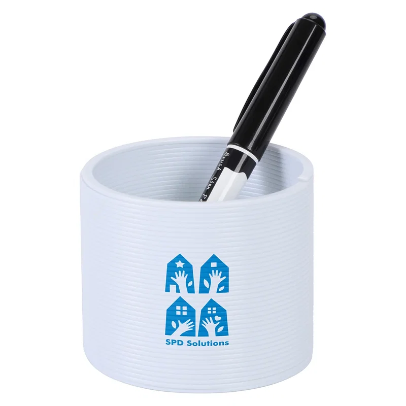 Dragon Spring Game collapsed into its cup shape in white, with a pen resting inside for scale