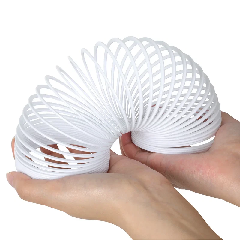 Dragon Spring Game's solid white coil spring cupped open in two hands