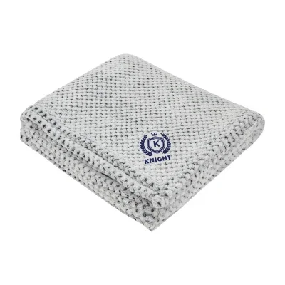 Plush blanket made from recycled material, folded and viewed from the front