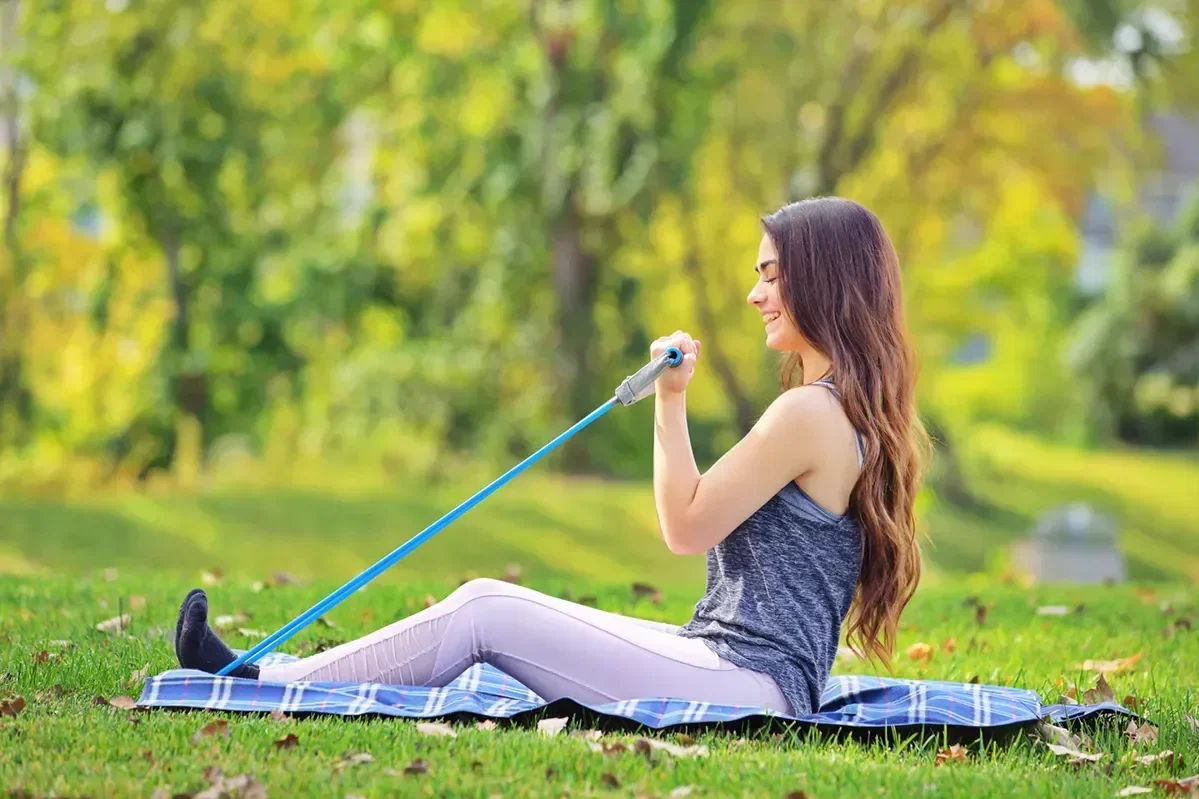 Custom Dynamo exercise band stretched to show soft-grip handles for training