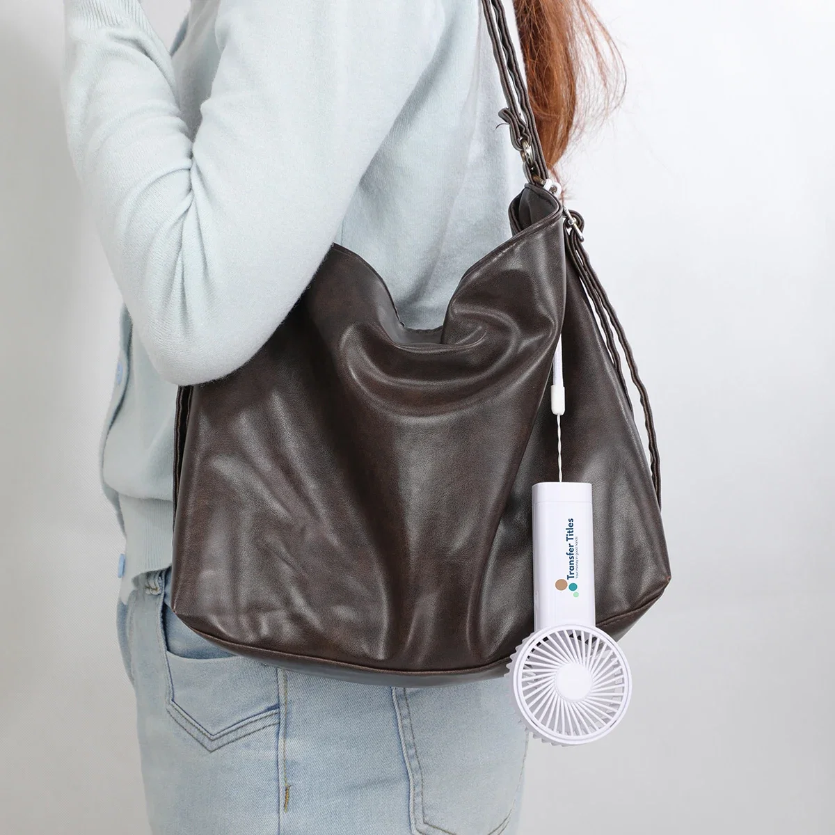 Easy Breeze Rechargeable Hand Fan in use