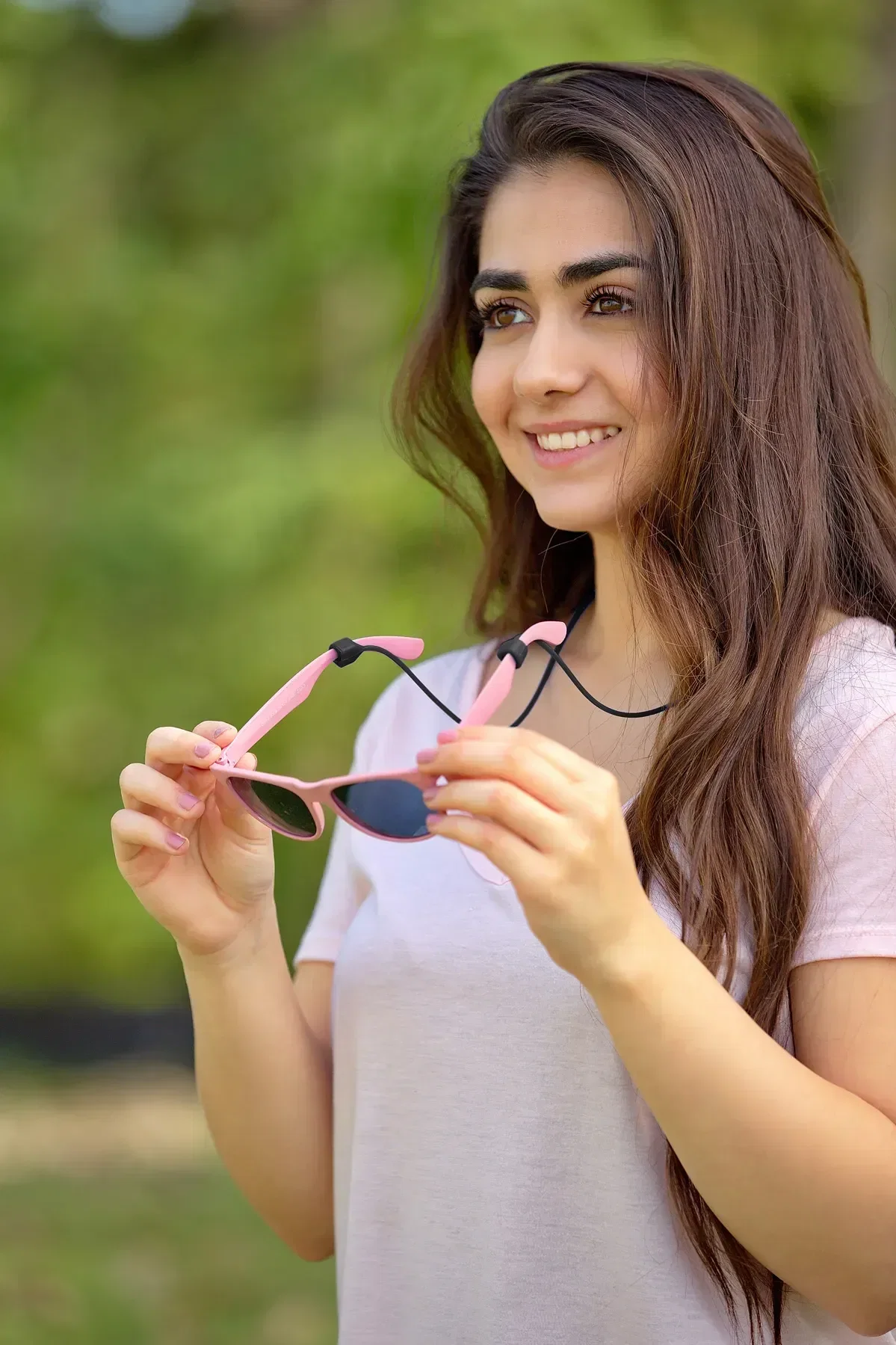 Easy-Wear Magnetic Earbud & Glasses Holder held in hand