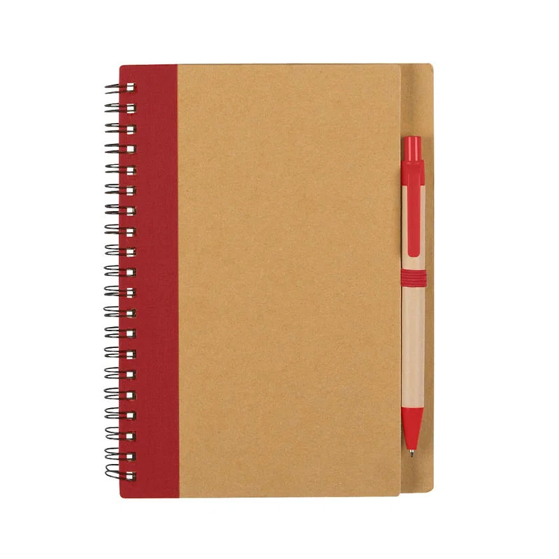 Writing tool laid diagonally across the open pages