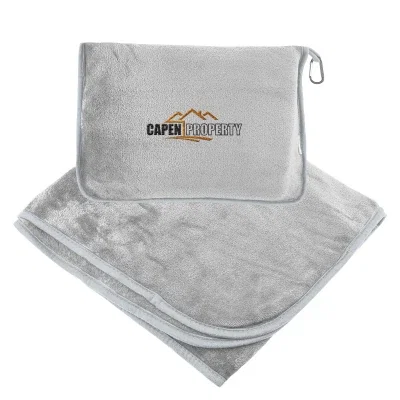 Gray pouch slipped over a suitcase handle for travel