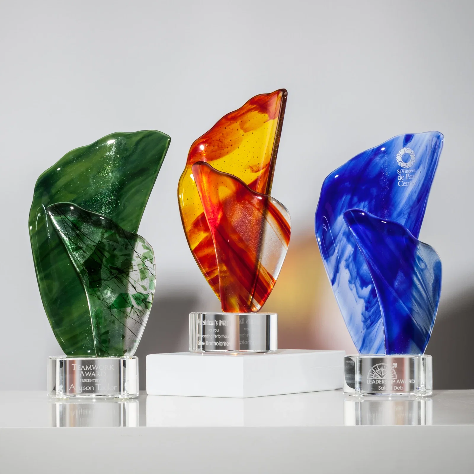 Custom Fused Green Red and Blue Art Glass Flame Award on Crystal Base for employee recognition