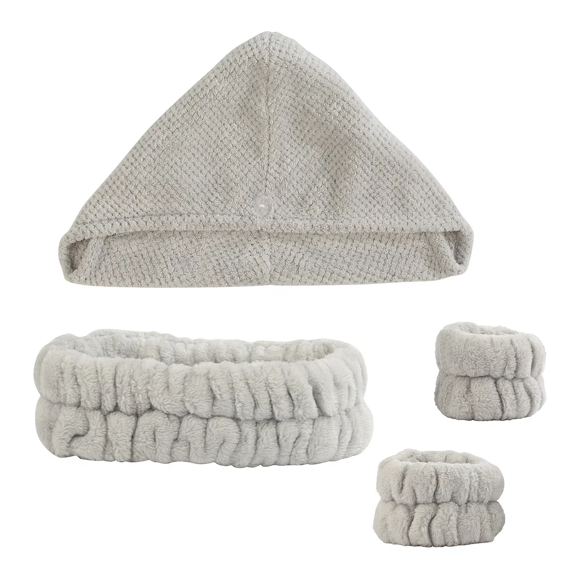 Angled view of the Esprit Hair Care Spa Kit's headband, wristband, and hair turban laid out together