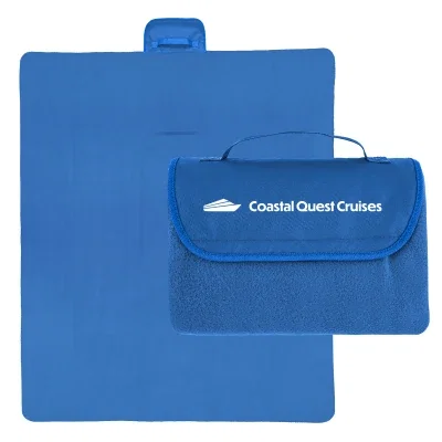 Extra large recycled blanket rolled up with a carry strap