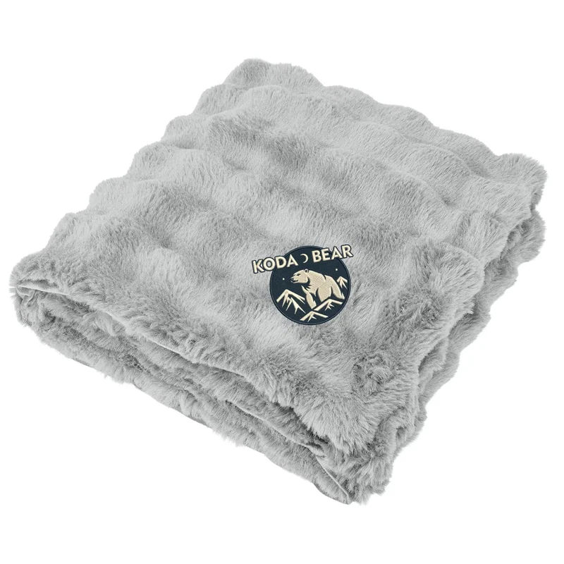 Navy throw wrapped around the shoulders for warmth