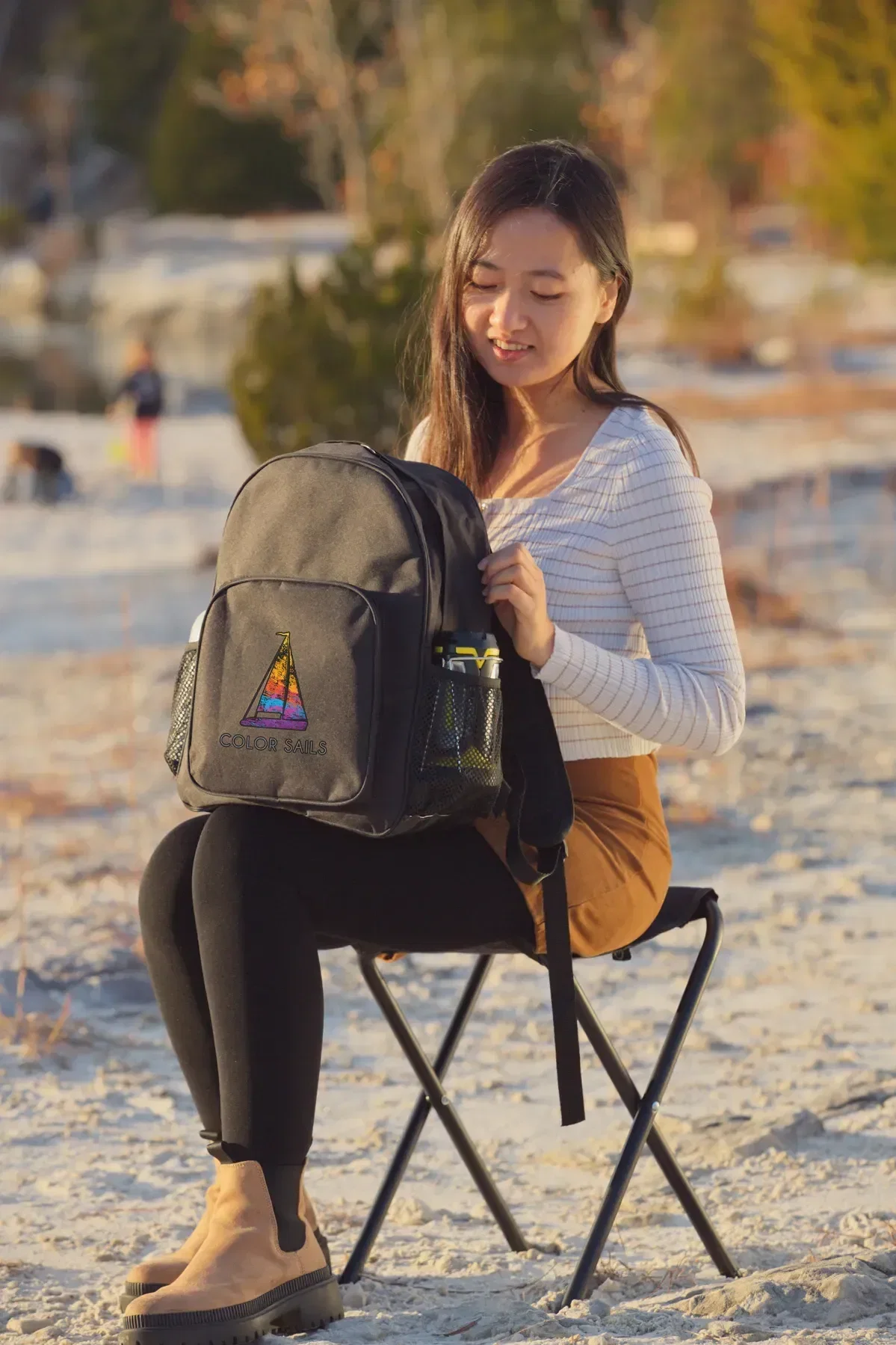 Fieldcrest Folding-Stool Cooler Backpack held in hand