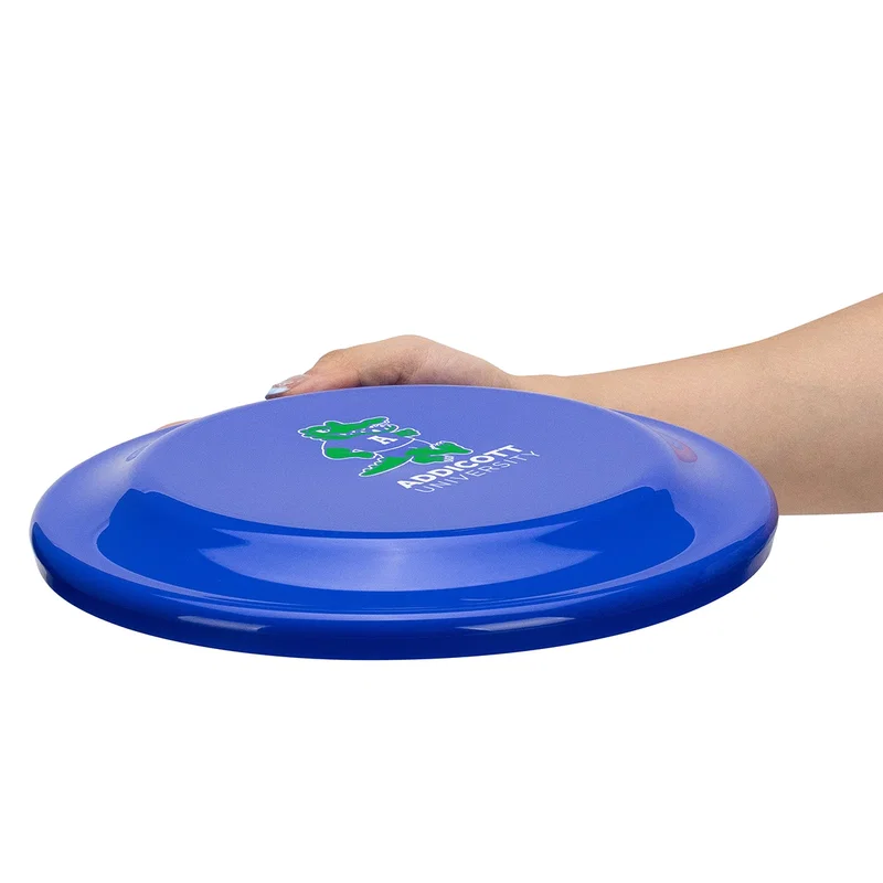 Flick Flyer discs from both sizes laid side by side on a table, size comparison shot