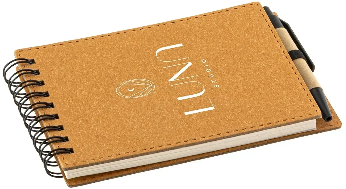 Branded recycled spiral notebook open with pen, interior pages