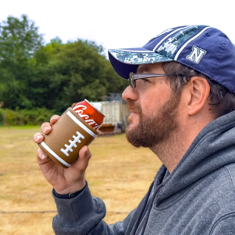 Football Can Cooler held in hand