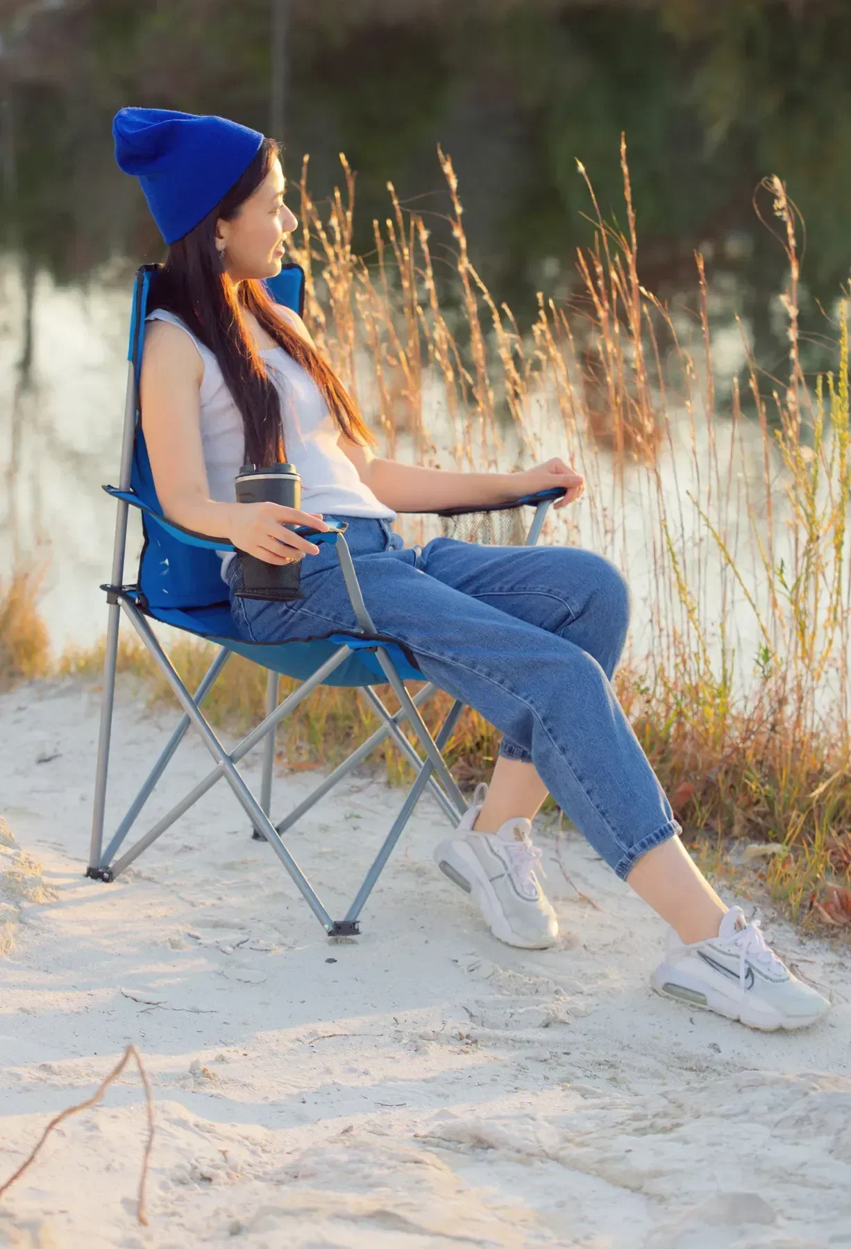Close-up of custom folding chair armrest and cup holder