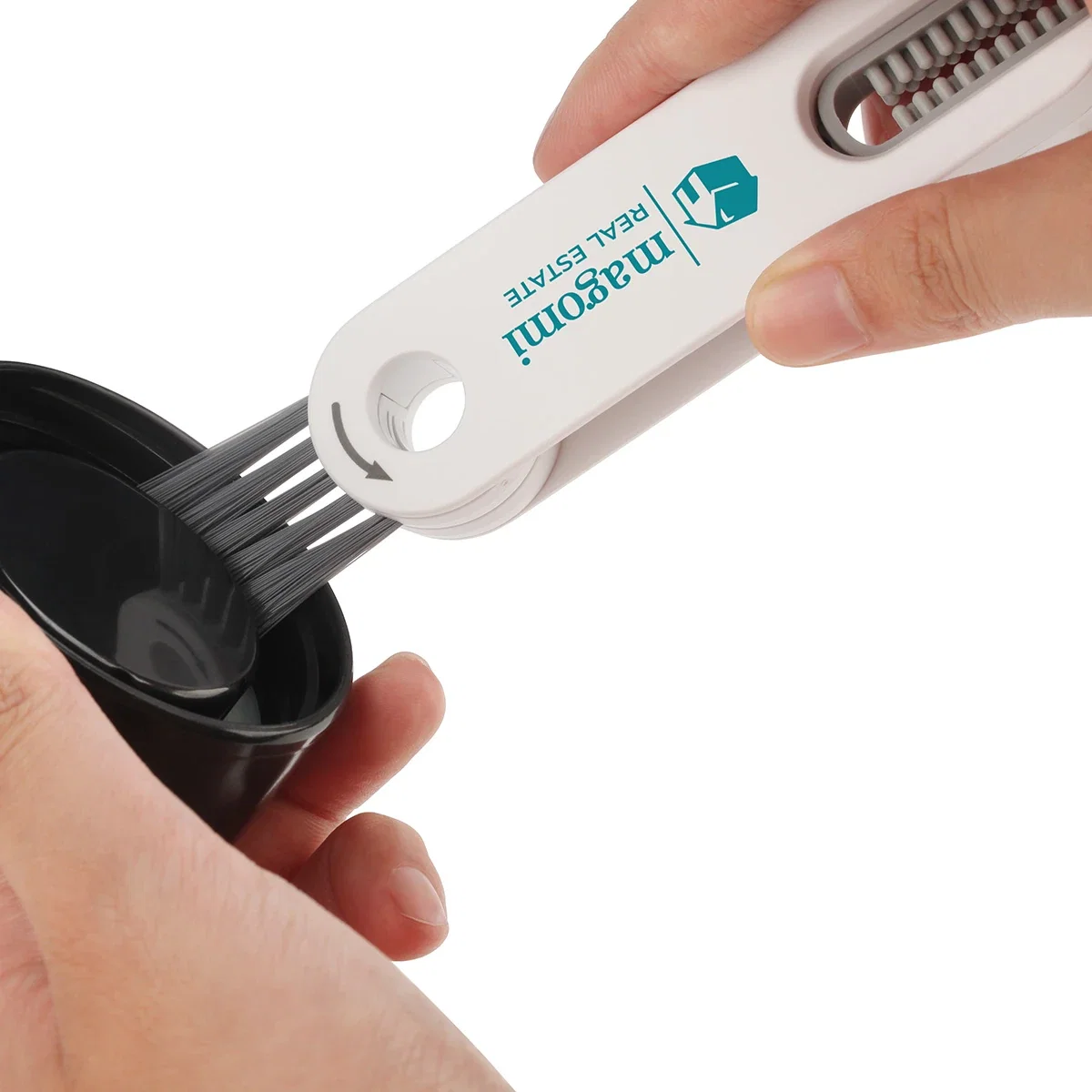 Branded Gap 3-in-1 Cleaning Brush in use scrubbing a tight gap