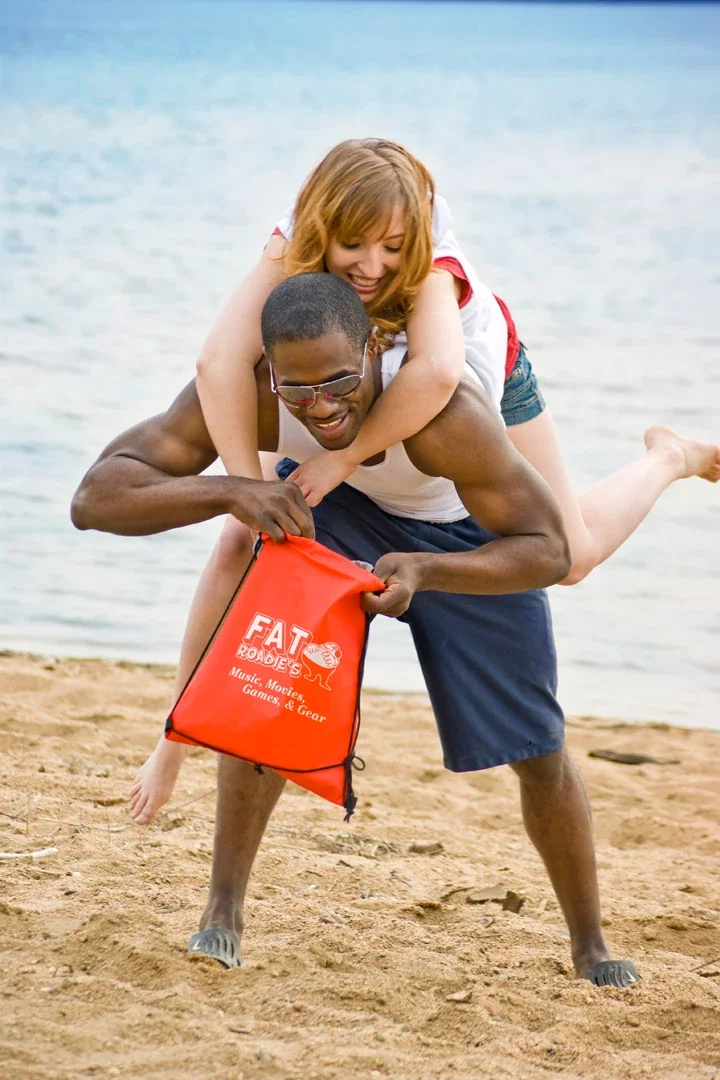 Glide Right 2-Tone Drawstring Backpack held in hand