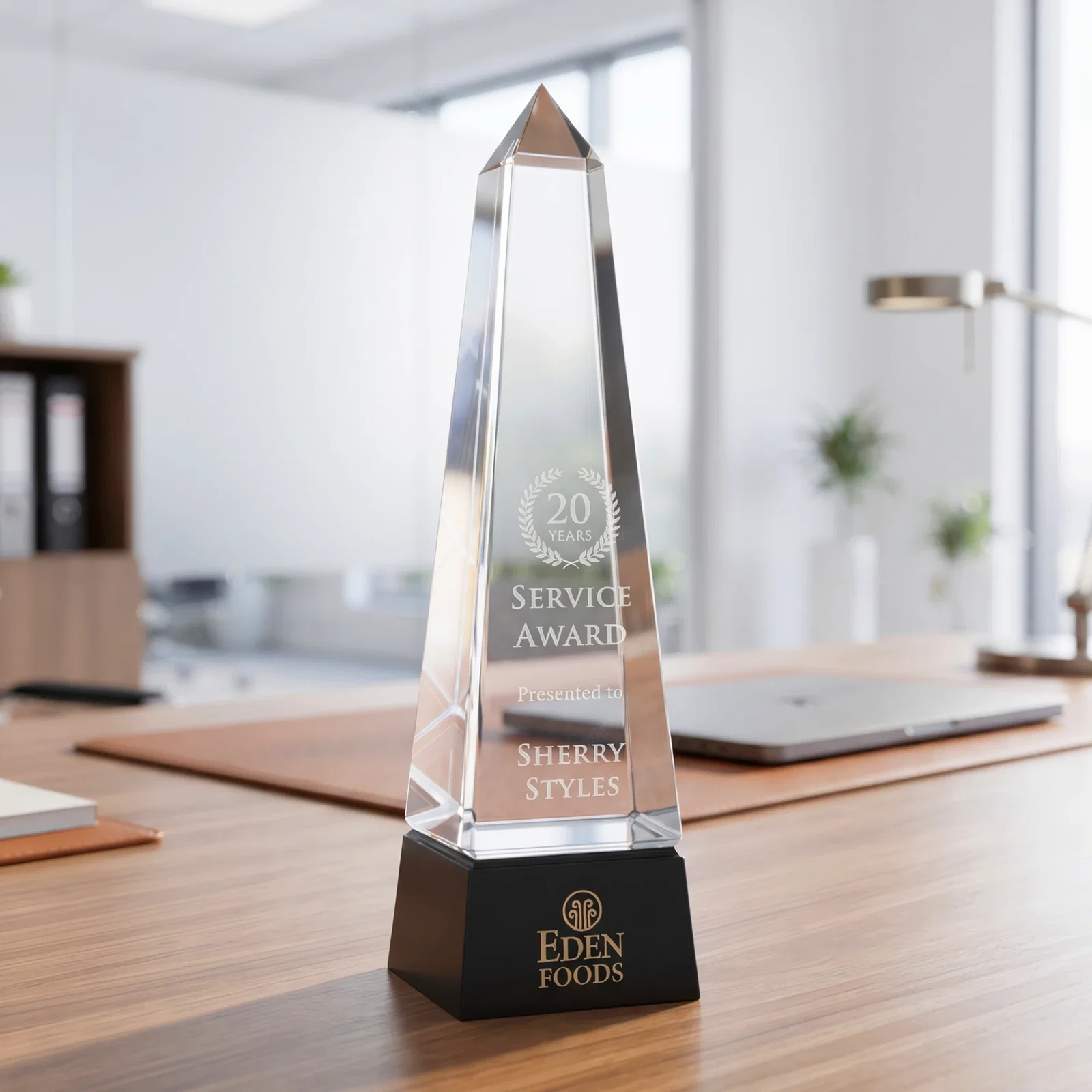 Custom Optical Crystal Obelisk Award with Grooved Sides on Black Base for team milestone celebrations