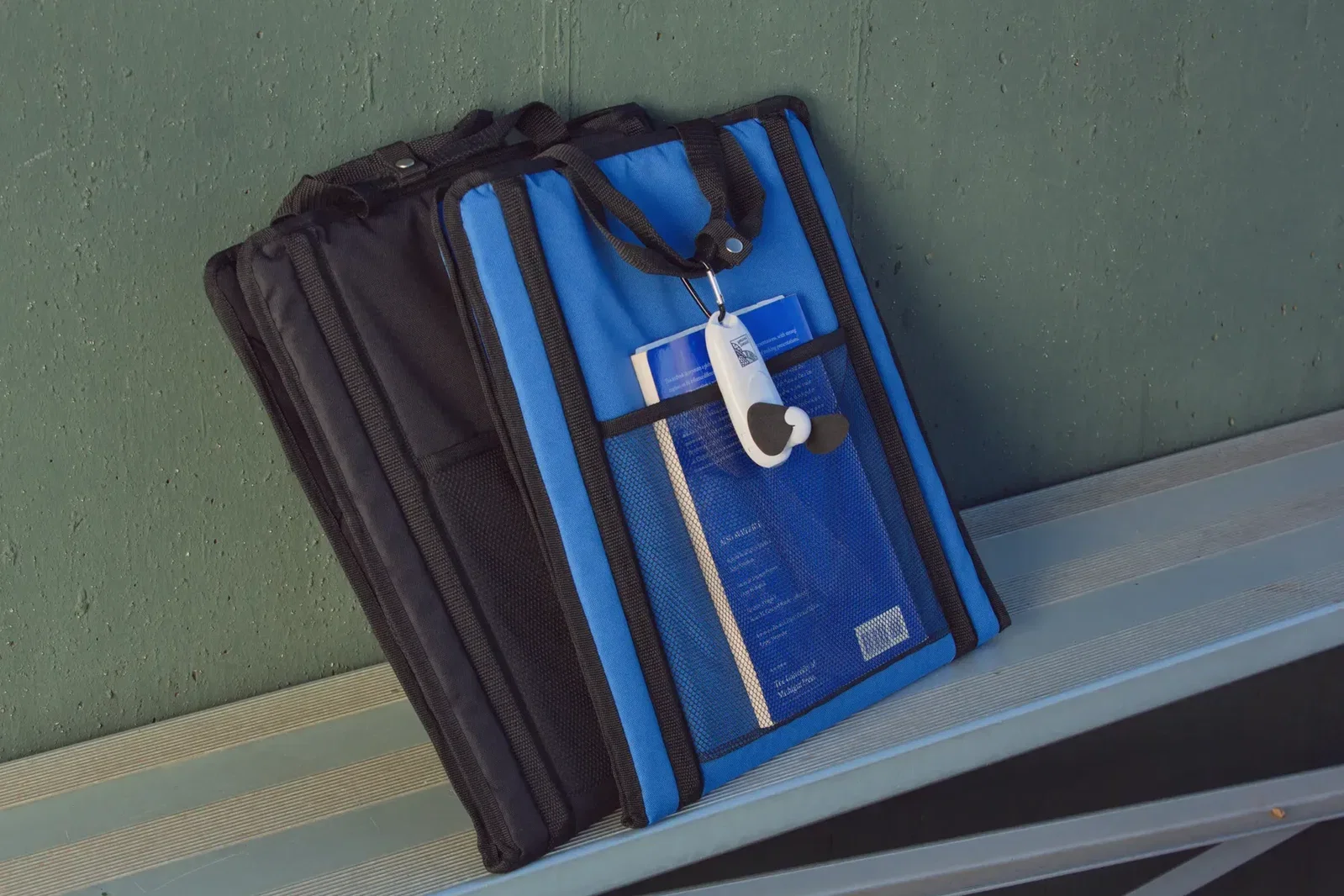 Custom Handy Breeze fan clipped onto a bag by its branded carabiner
