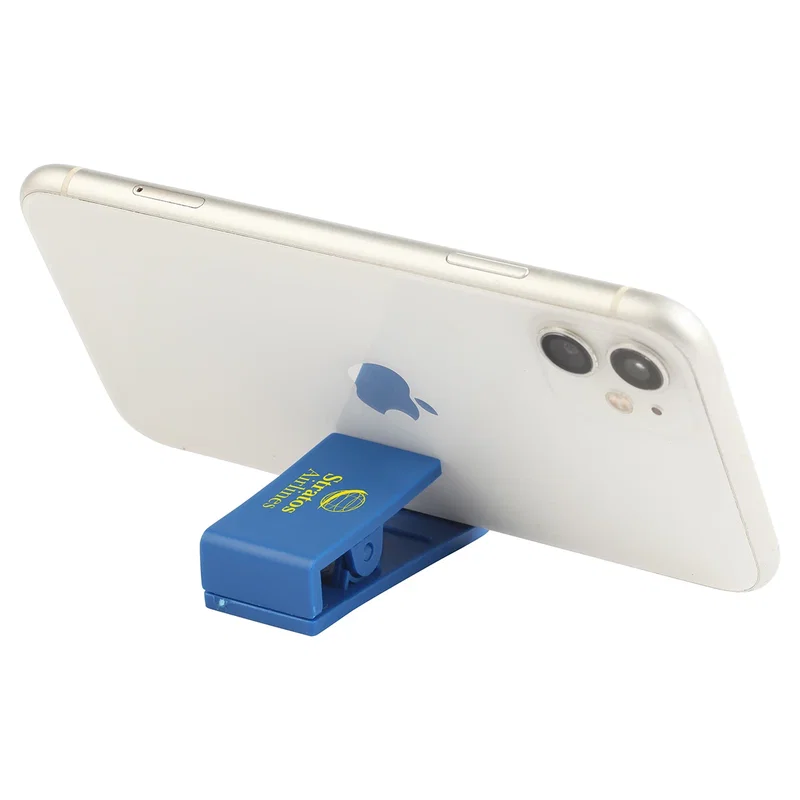 Custom Handy Clip holding a smartphone upright, phone stand in use