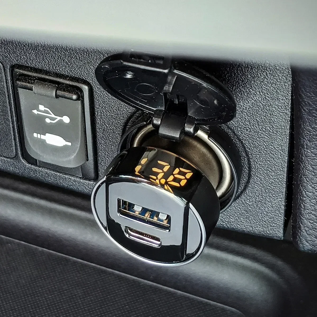 ihub PowerDrive promotional car charger, angled view showing dual USB ports